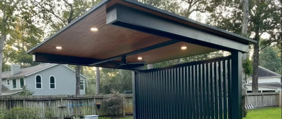 Wooden roof of a gazebo in Kingwood, TX, with a fan.