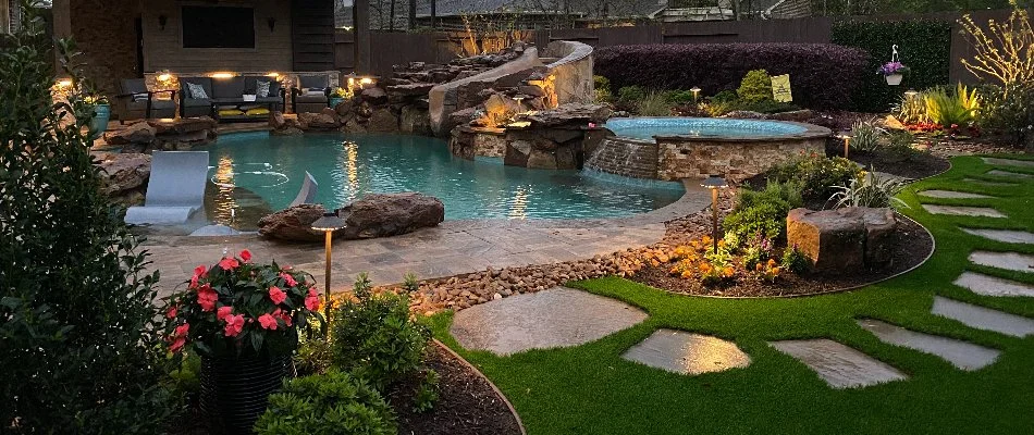 Landscaping and pool with LED lights in Kingwood, TX.