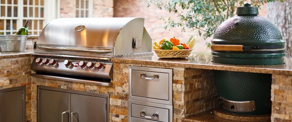 Outdoor kitchen in Kingwood, TX, with a grill.