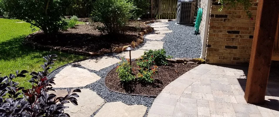 Stone walkway through landscaping in Kingwood, TX.