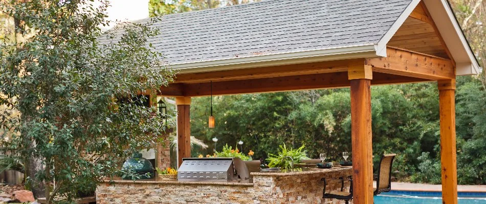 Wooden pavilion over an outdoor kitchen in Kingwood, TX.